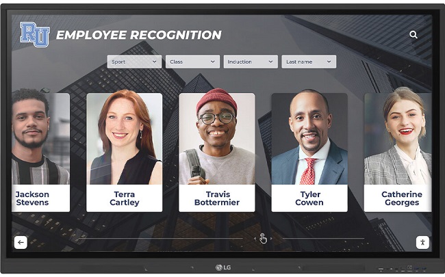 Interactive employee recognition touchscreen monitor featuring awards, milestones, and peer kudos.